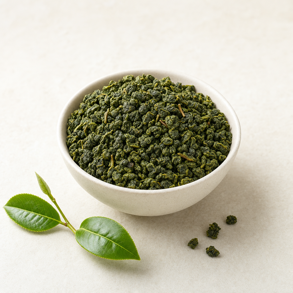 Cloud Ridge Oolong loose-leaf rolled jade pellets in a medium tea bowl on a pale stone surface, with a fresh one-bud-two-leaves tea sprig